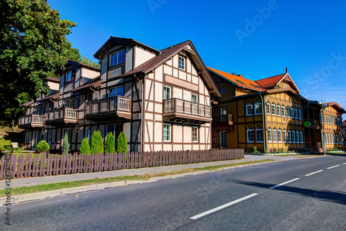 Traditional Lithuanian wooden and half-timber houses in the countryside. Juodkrante village, Lithuania.