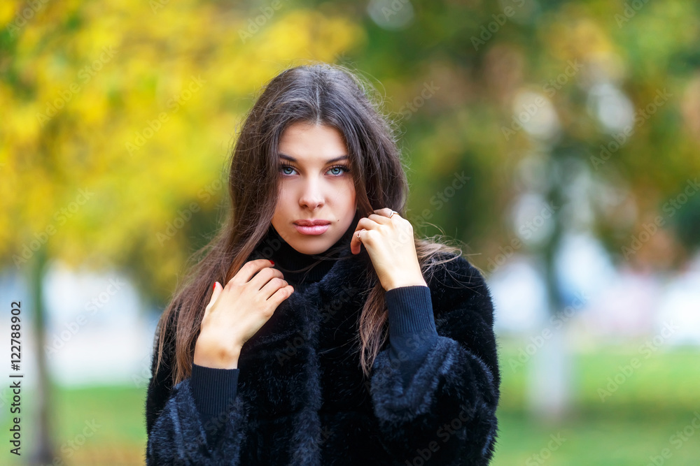 Beautiful young woman walking in autumn park. Autumn fashin concept. Beautiful young woman walking in autumn park. Autumn fashin concept.