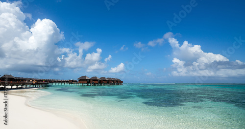 Beautiful beach with water bungalows at Maldives, panorama forma