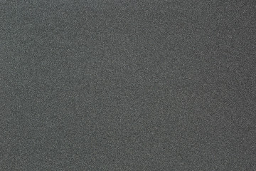 Gray monotone grain texture. Glitter sand background.