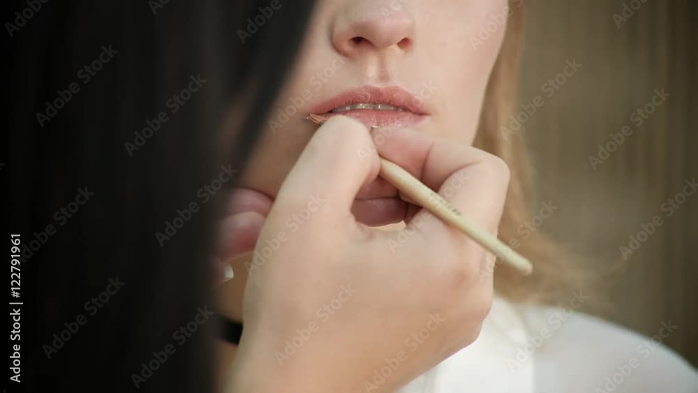 the Make-Up Stylist Doing a Make-Up to Hipster Model the Make-Up Stylist Doing a Make-Up to Hipster Model