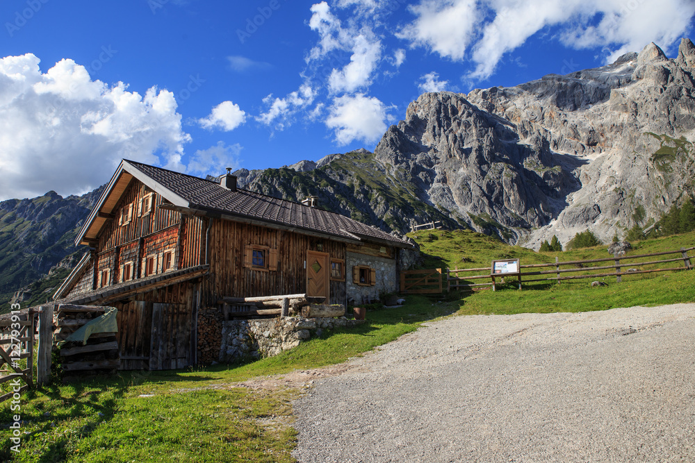 Typical mountain huts in the Austrian Alps,on a sunny day with r