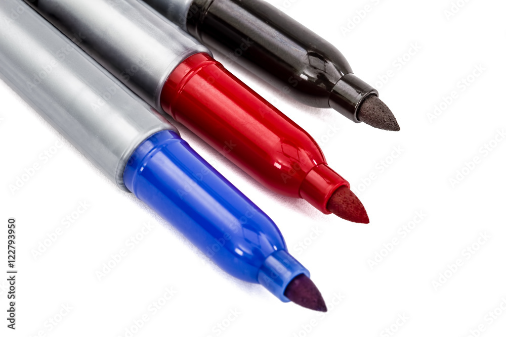 Three felt-tip pens markers highlighters close-up, isolated on w Three felt-tip pens markers highlighters close-up, isolated on w