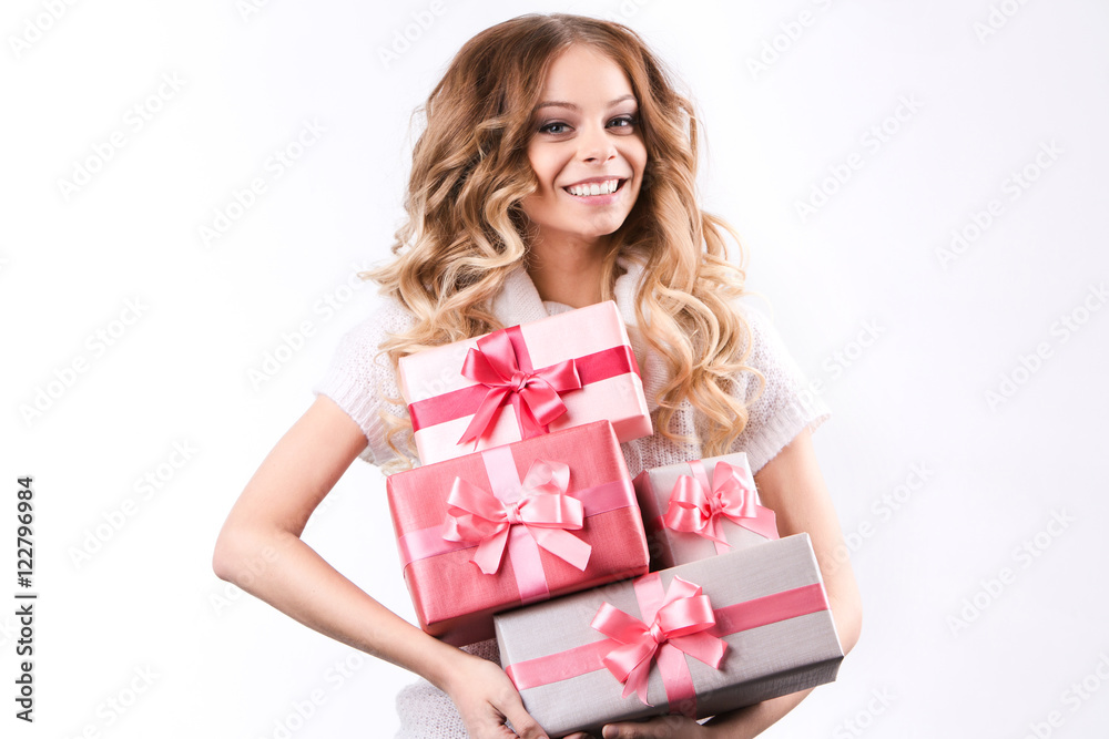 Cheerful woman with gifts on white background. Cheerful woman with gifts on white background.