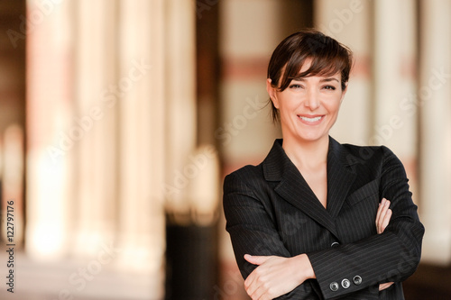 Fotografie, Tablou Confident lawyer businesswoman professor with arms crossed on university college