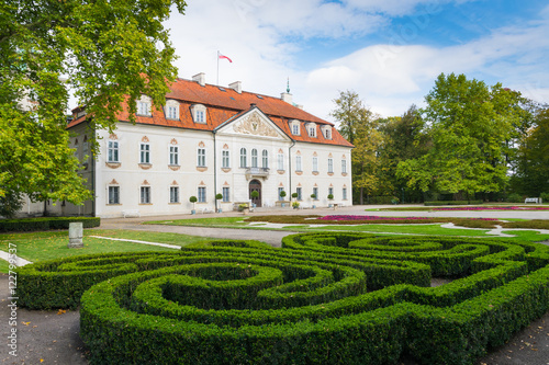 Back view of Radziwill family palace of Nieborow, in baroque style, surrounded by a french garden.