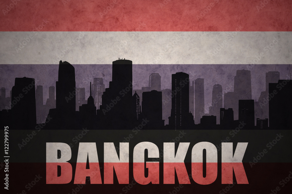 abstract silhouette of the city with text Bangkok at the vintage thailand flag background
