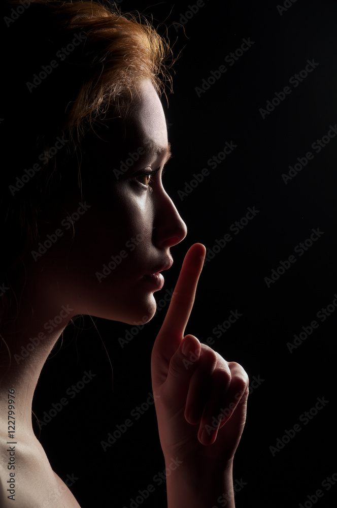 Naklejka premium Young Woman Gesturing For Being Quiet