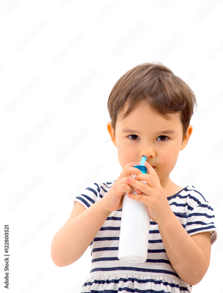 little girl using nasal spray - white background little girl using nasal spray - white background