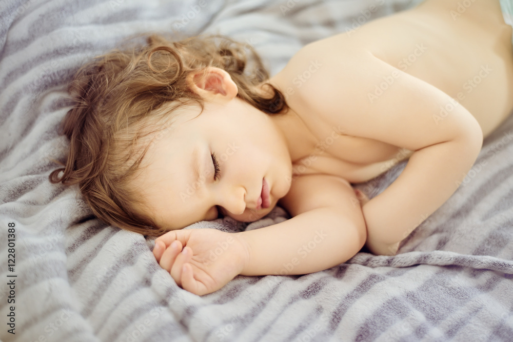 Close-up portrait of a beautiful sleeping baby. Cute infant kid. Child portrait in pastel tones. The beautiful baby could be a boy or girl Close-up portrait of a beautiful sleeping baby. Cute infant kid. Child portrait in pastel tones. The beautiful baby could be a boy or girl