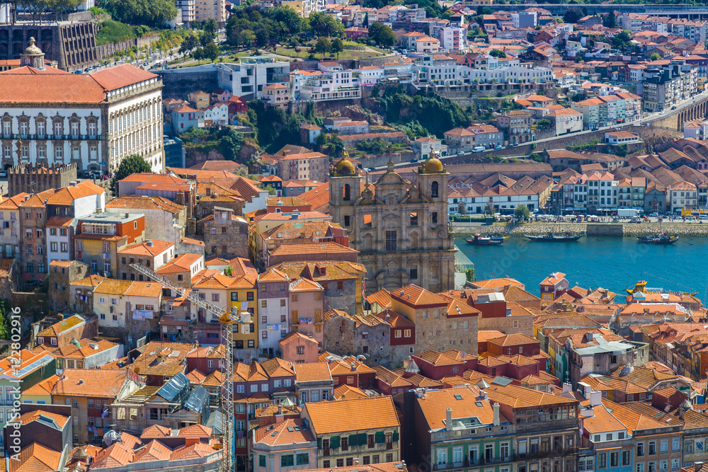 Aerial panoramic view of orange rooftops and historical buildings of the old city of Porto, Portugal