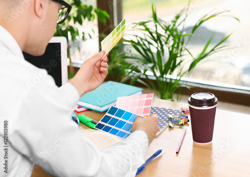 Man holding colour palette ...