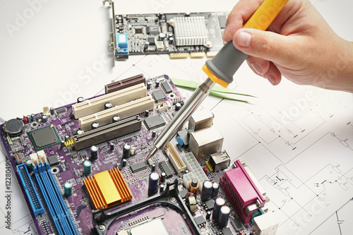 Man using soldering tool fo...