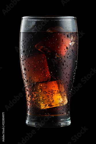 Cola glass with ice cubes and droplets