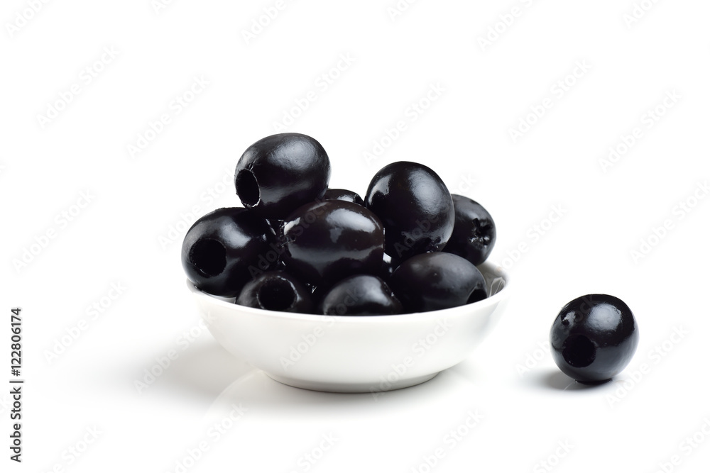Pickled pitted black olives in a bowl isolated on a white background Pickled pitted black olives in a bowl isolated on a white background