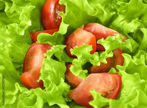 Background of healthy food. Salad closeup of fresh tomatoes