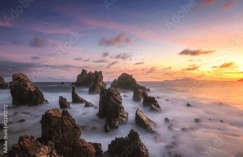 Amazing stones at beach in sunset. Locations in Pegadung Beach Lampung, indonesia