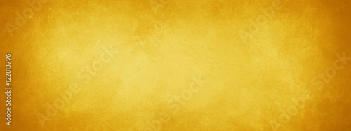 gold background with vintage texture, yellow background with brown border, old yellow paper or parchment photo