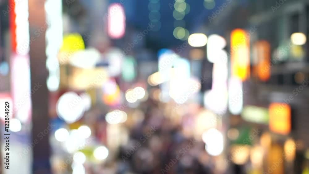 Crowds of Japanese and tourist at night walking at Takeshita street, Harajuku, Tokyo, Japan. 
