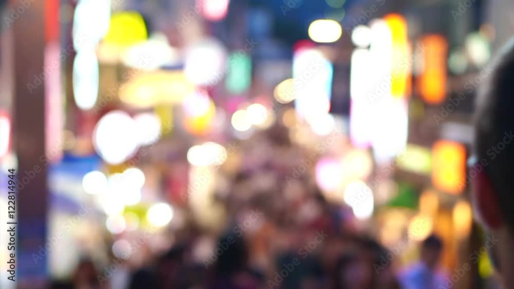 Crowds of Japanese and tourist at night walking at Takeshita street, Harajuku, Tokyo, Japan. 