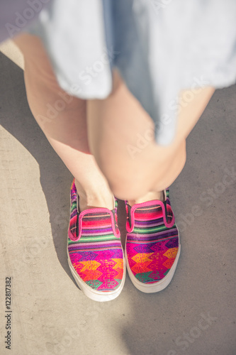 colorful woman fashion blogger shoes elevated view first person