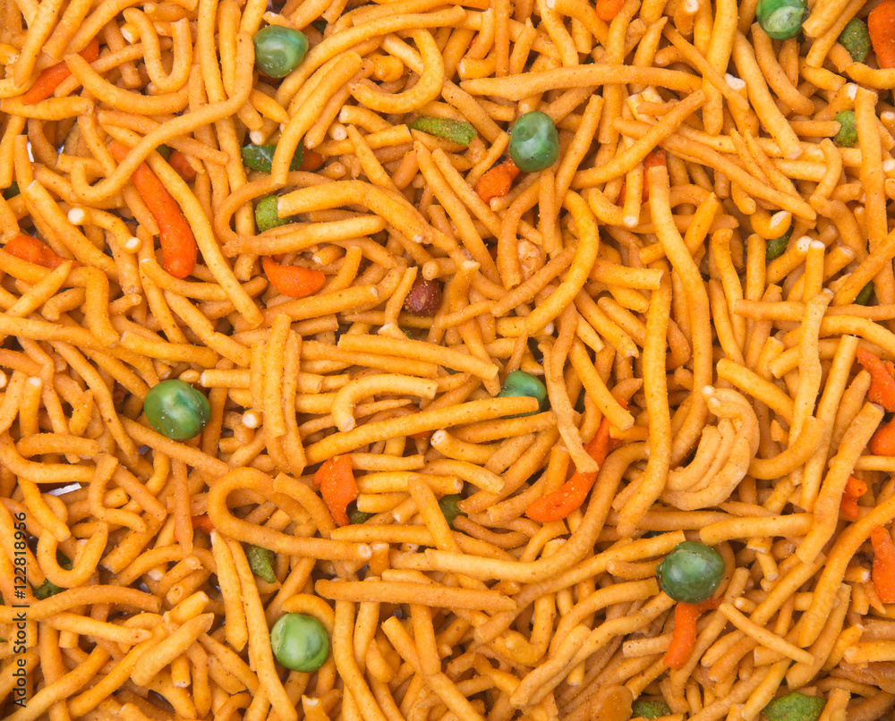 murukku or traditional indian snack on background. murukku or traditional indian snack on background.