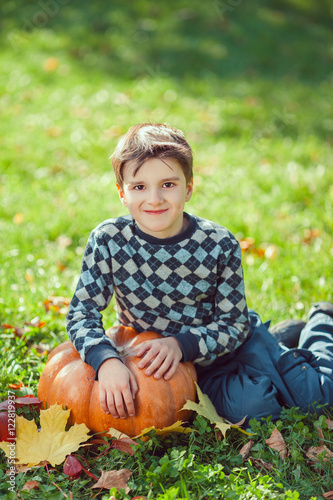 Boy Playing With Pumpkin