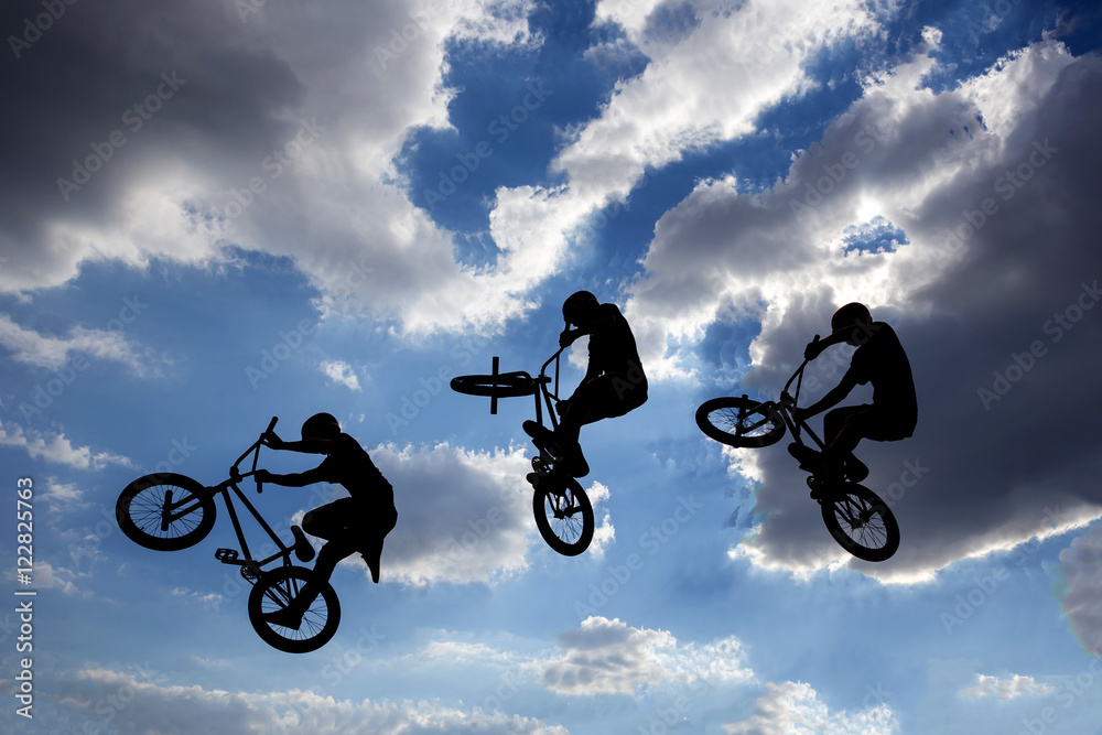 Bike jump silhouettes multiple exposure Bike jump silhouettes multiple exposure