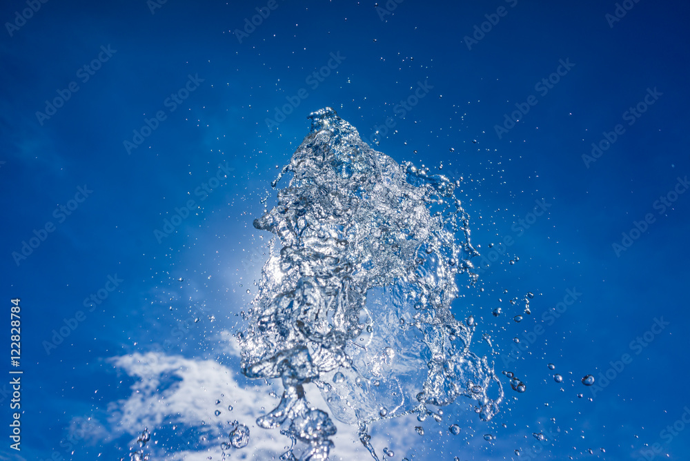 Stream of water divided into droplets