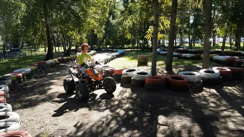 Little girl riding quad bike. photo