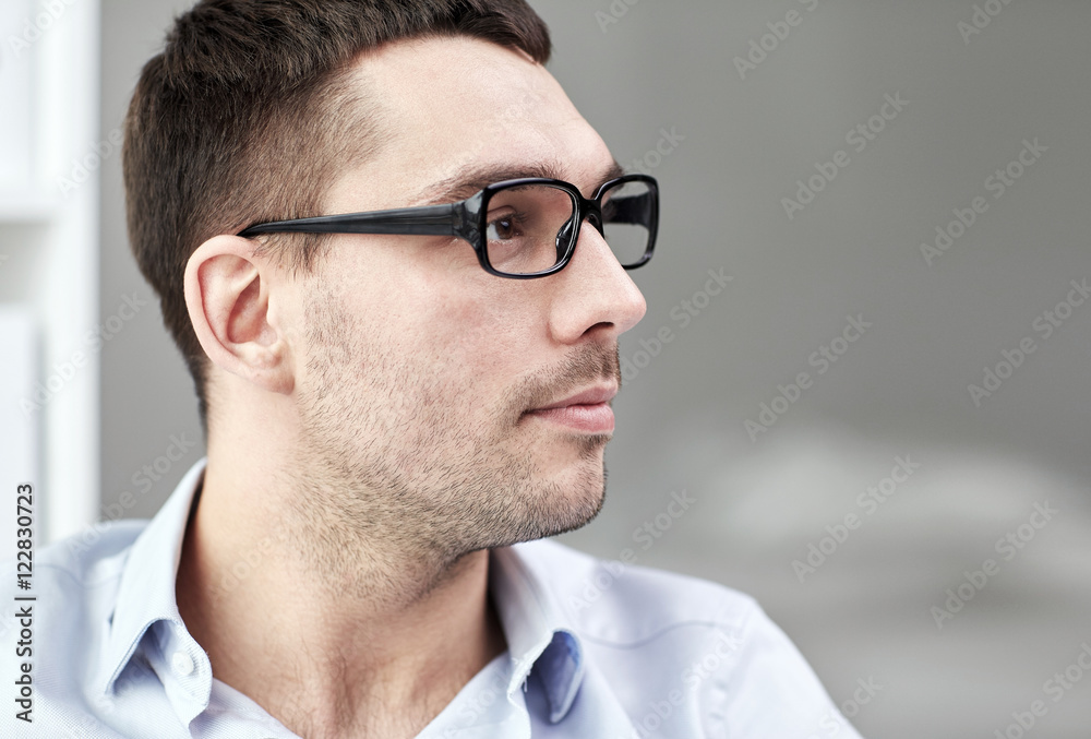 portrait of businessman in eyeglasses at office portrait of businessman in eyeglasses at office