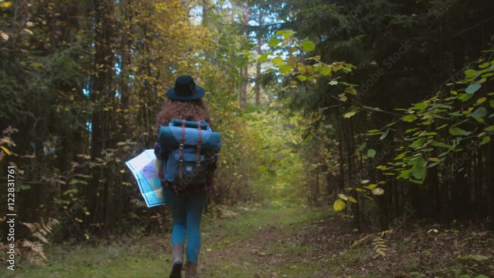 TRACKING FOLLOW Active healthy Caucasian woman with a backpack hiking in autumn forest. Young hiker holding a map. 4K UHD RAW edited footage TRACKING FOLLOW Active healthy Caucasian woman with a backpack hiking in autumn forest. Young hiker holding a map. 4K UHD RAW edited footage