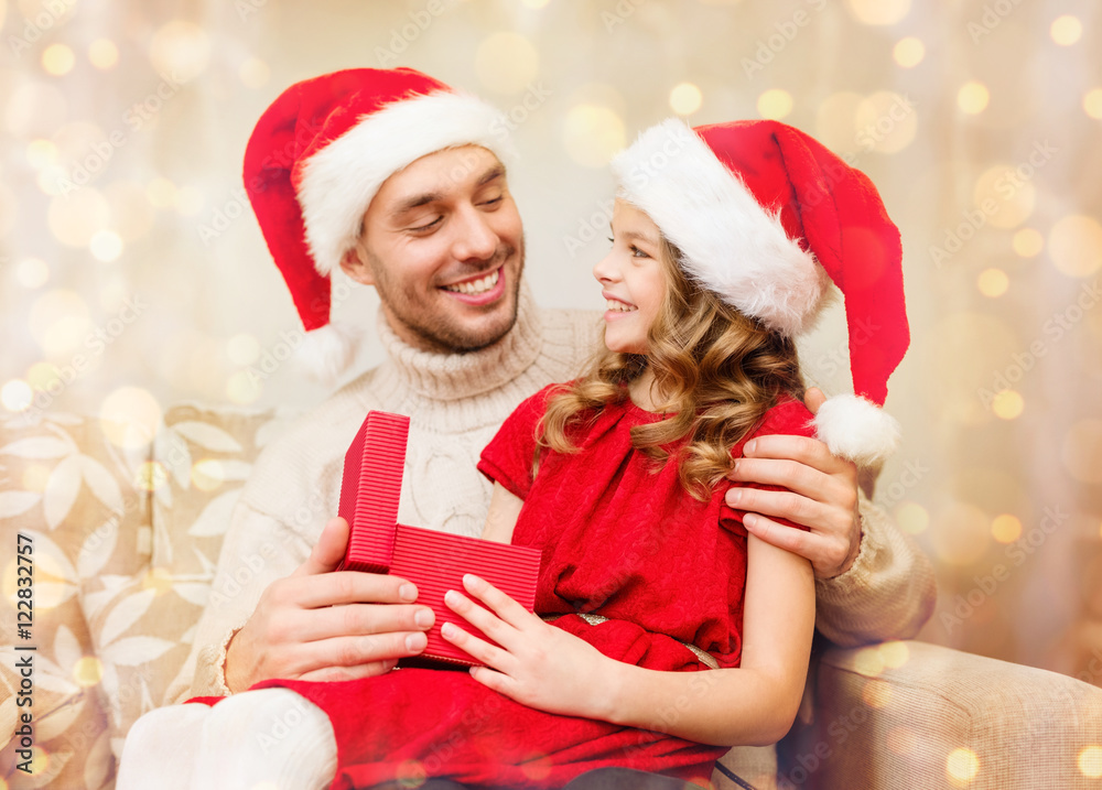 smiling father and daughter opening gift box smiling father and daughter opening gift box