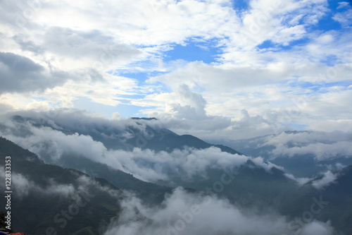 Mountain landscape with peaks covered by clouds