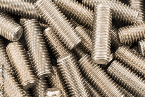 Threaded stainless steel bolts background