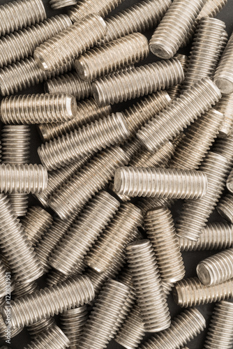 Threaded stainless steel bolts background