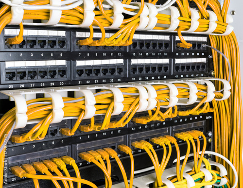 Obraz na płótnie Close up of yellow network cables connected to switch w salonie