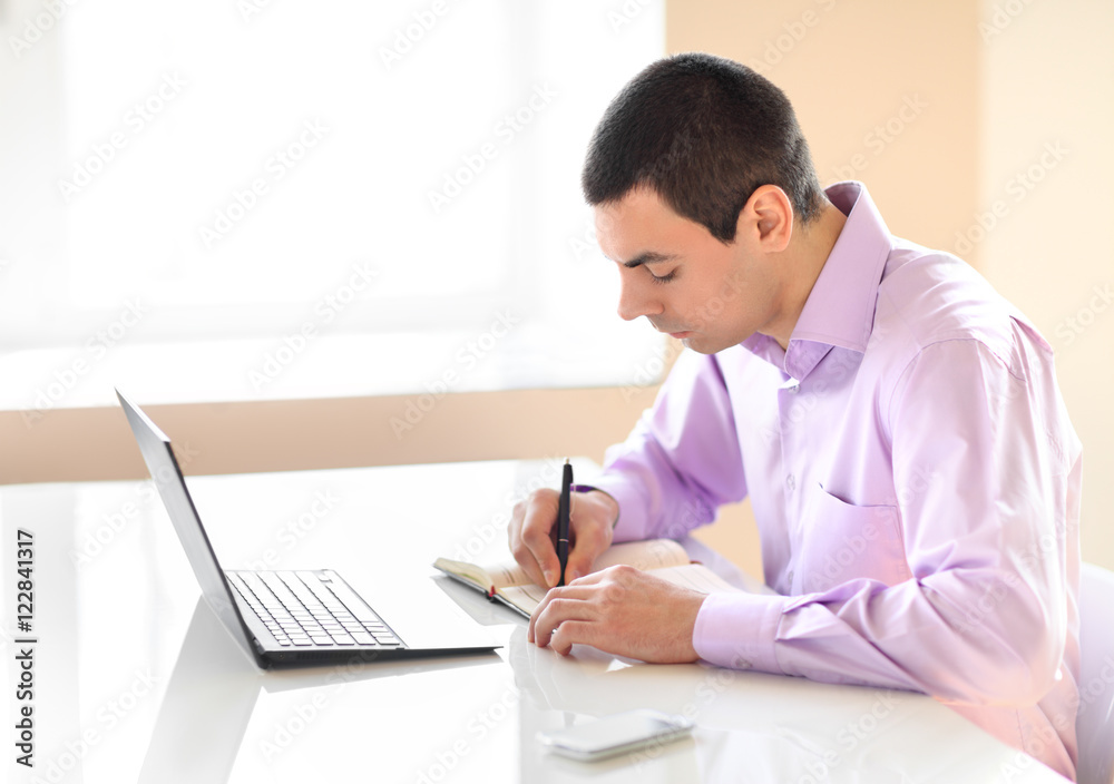 Business man working with documents and laptop Business man working with documents and laptop