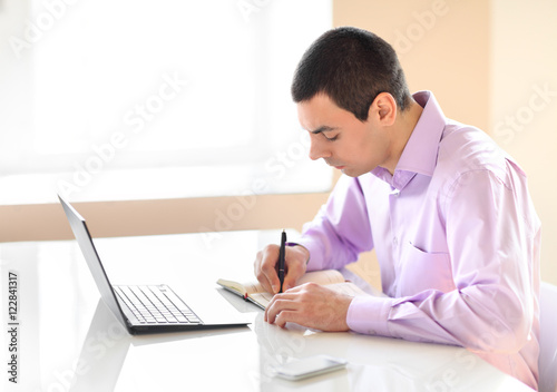Business man working with documents and laptop