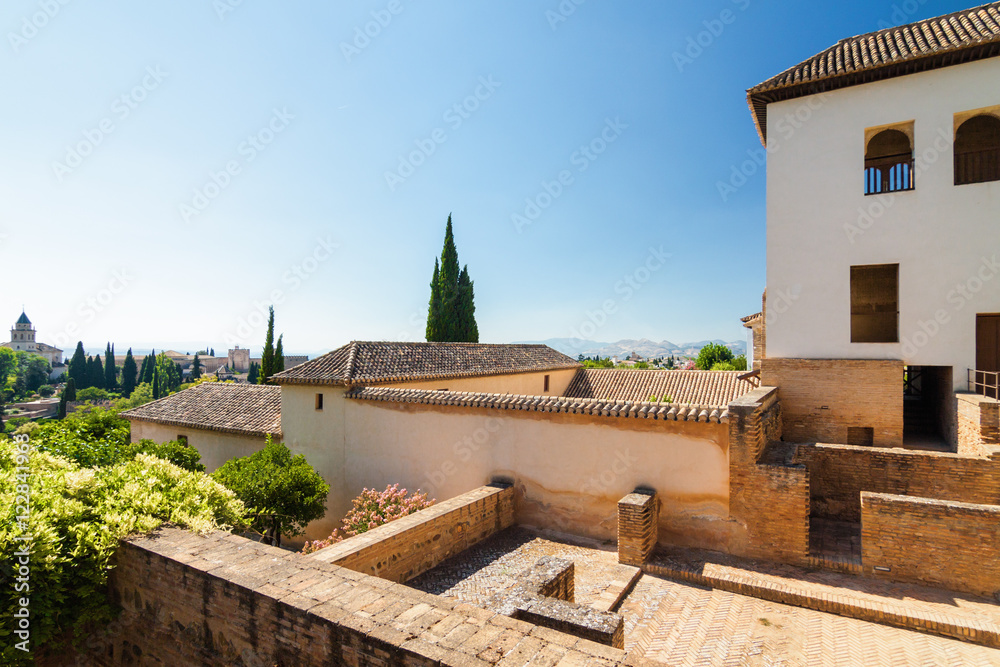 Obraz premium Sunny view of Granada from viewpoint of garden of Generalife, Andalusia province, Spain.