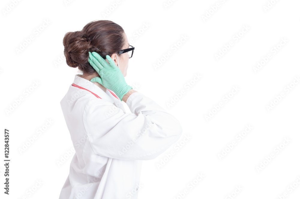 Back view of female assistant arranging her hair Back view of female assistant arranging her hair