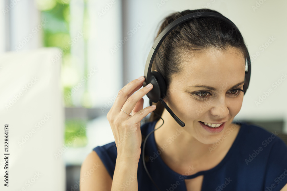 Portrait of natural woman customer service operator with headset Portrait of natural woman customer service operator with headset