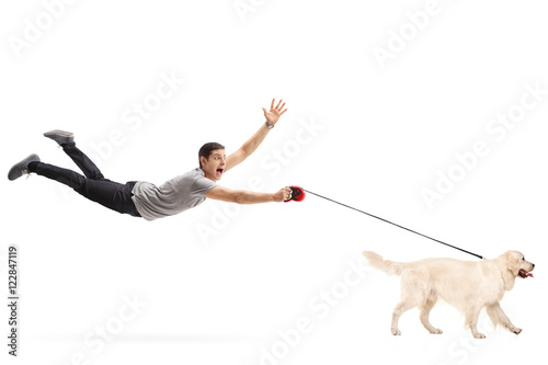 Guy being pulled by his dog