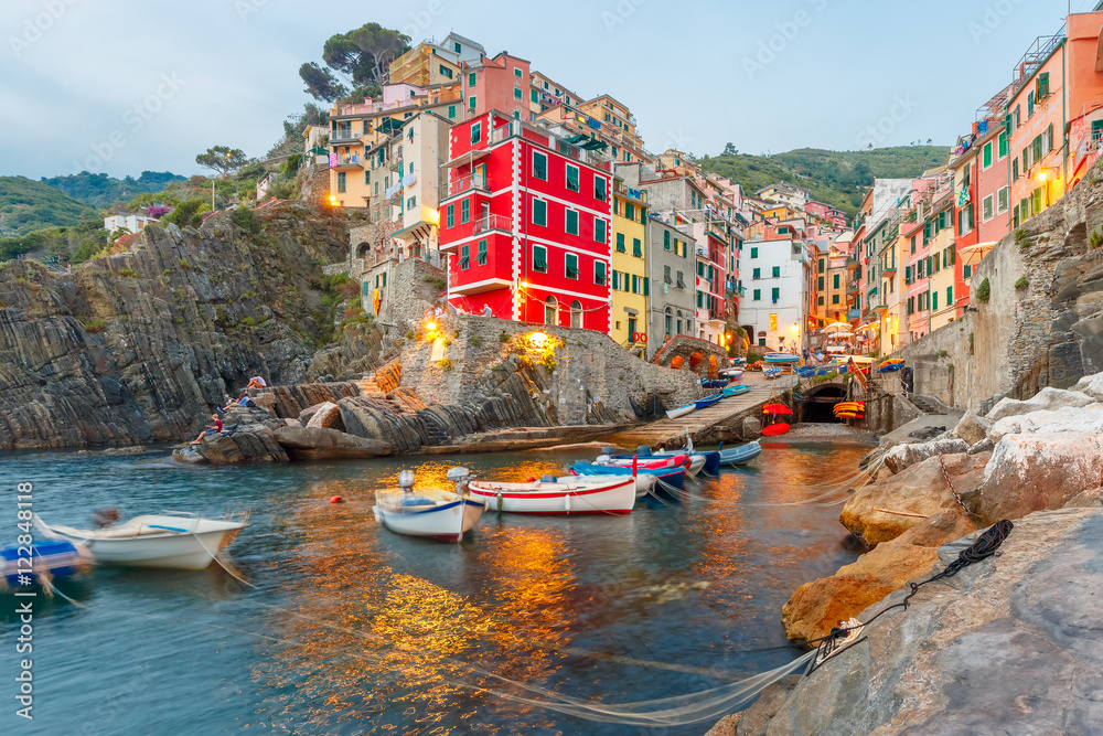 Riomaggiore fishing village in the evening, seascape in Five lands, Cinque Terre National Park, Liguria, Italy.