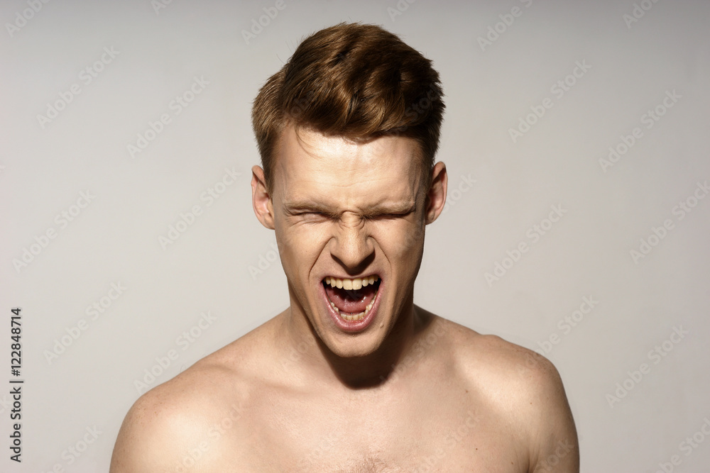 Wunschmotiv: Fashion closeup portrait of young handsome red hair shouting with closed eyes #12284871