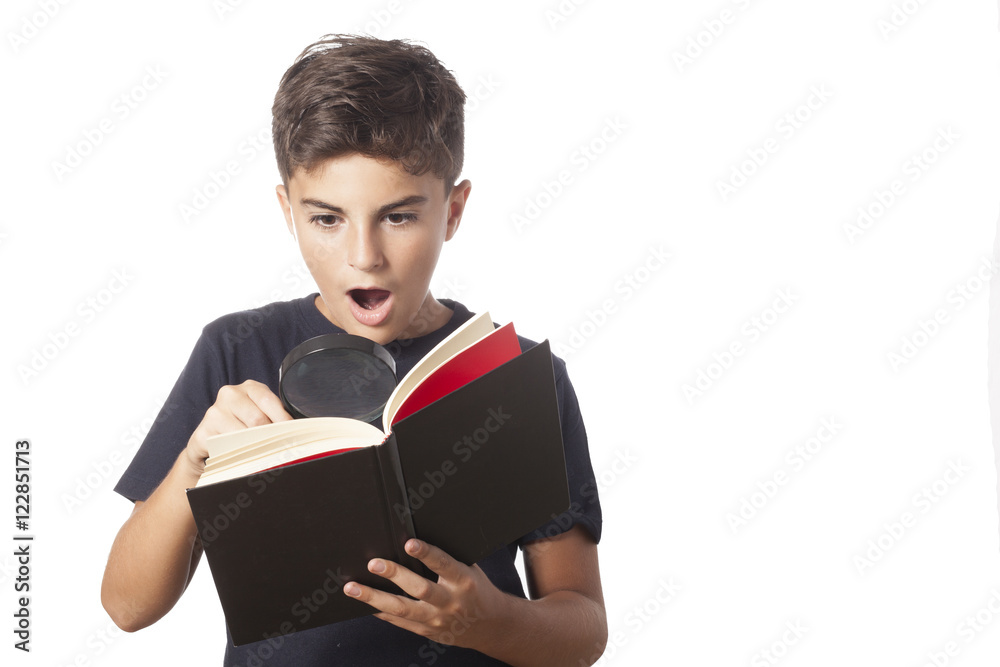 surprised child read a book with magnifyng glass surprised child read a book with magnifyng glass
