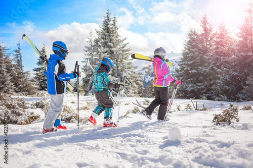  happy family ski team fun on beautiful mountain