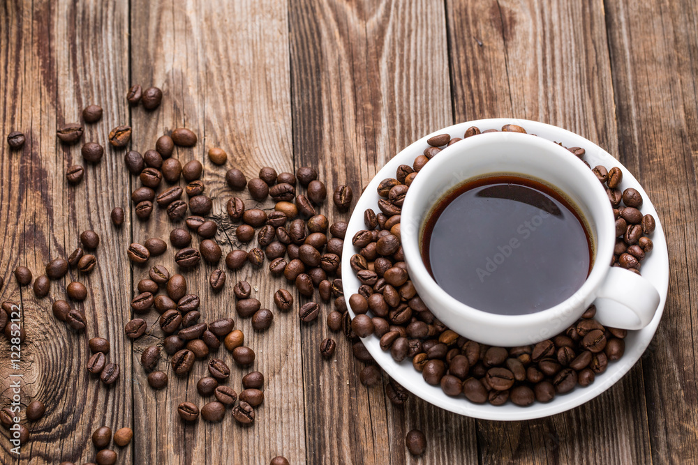 Coffee cup and coffee beans. Coffee cup and coffee beans.
