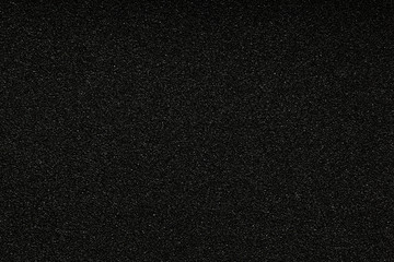 Black monotone grain texture. Glitter sand background.