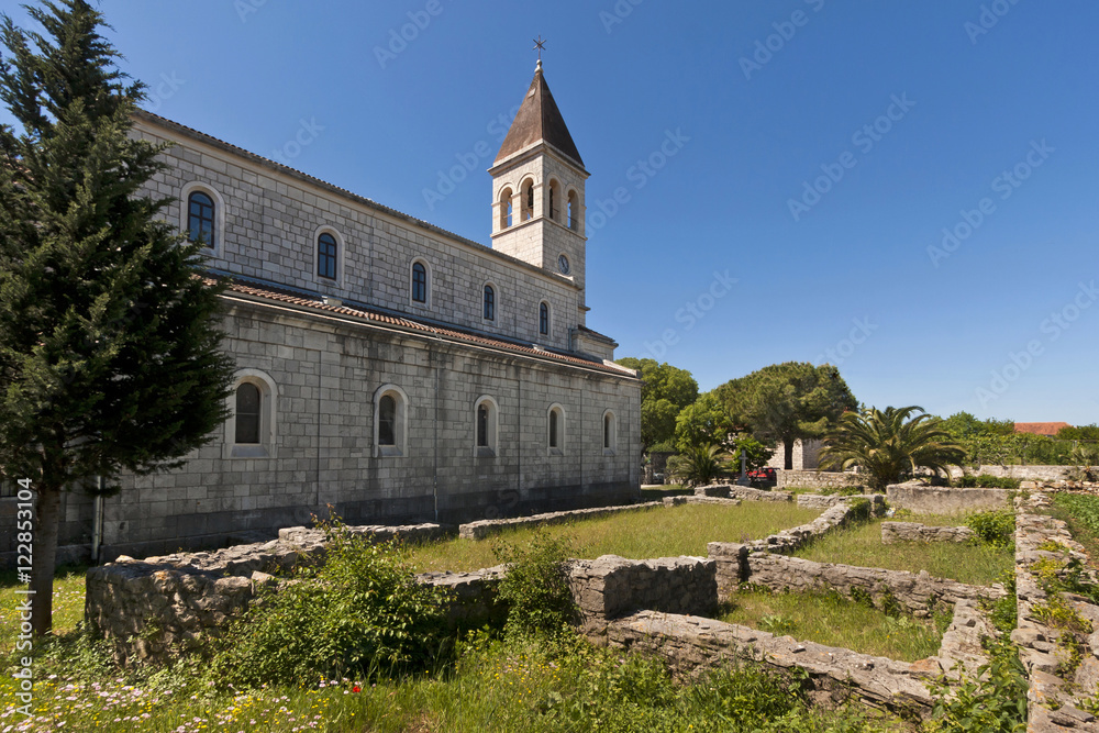 Church of St. Stephen and ruins of old church in Grohote, village on island Solta in Croatia